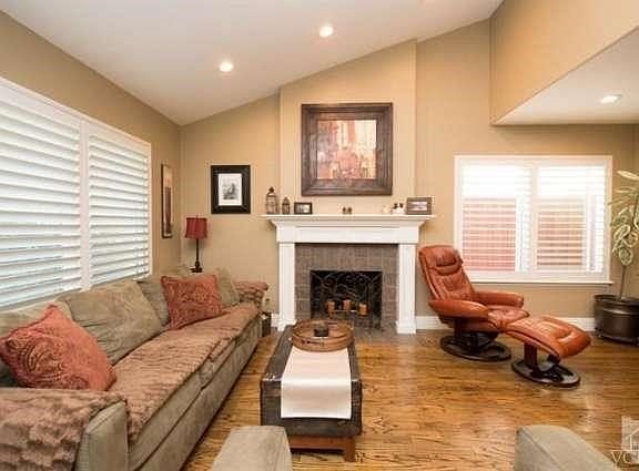 Living room offers windows to front of house