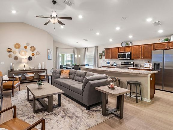 Enjoy a sunny, open living area with luxury vinyl plank flooring.