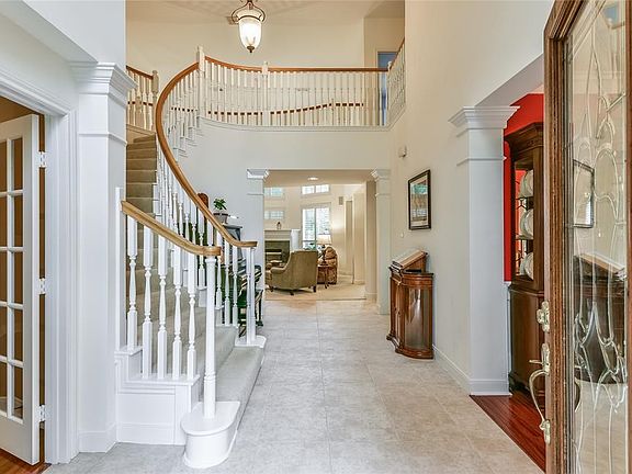 Bright two story entry greets you with sweeping staircase and great natural light.