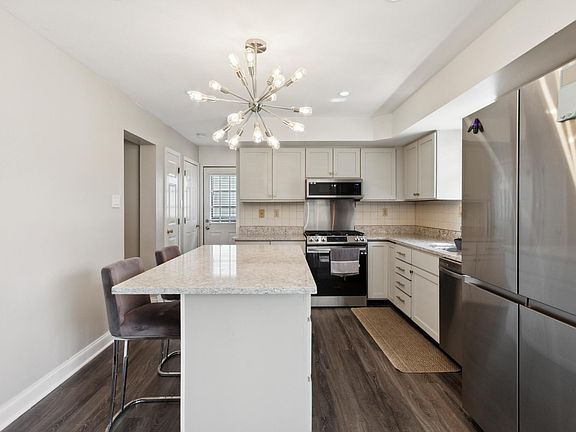 Kitchen fully equipped with new stainless steel appliances and granite counter tops