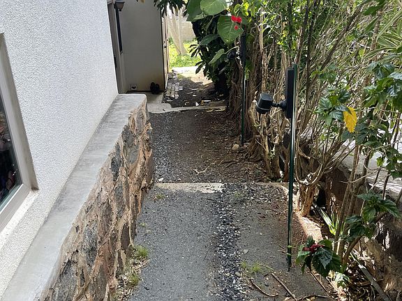 Right side of house with steps to downstairs rental unit