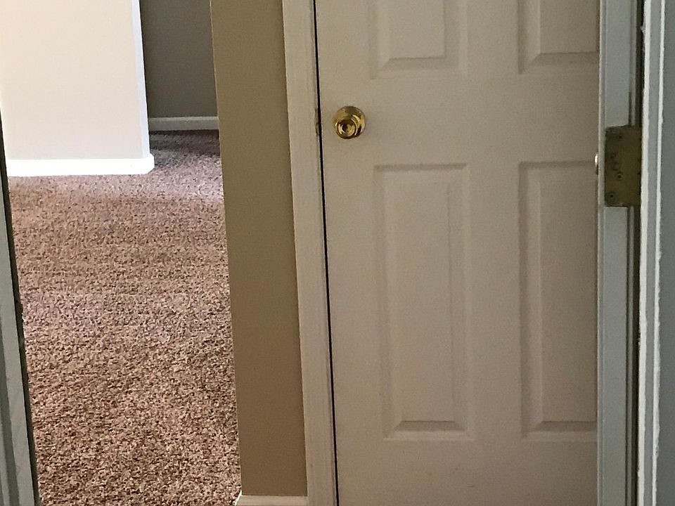 View from front door entrance, showing coat closet and entry into living room.