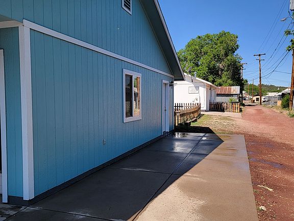 Additional paved parking beside garage