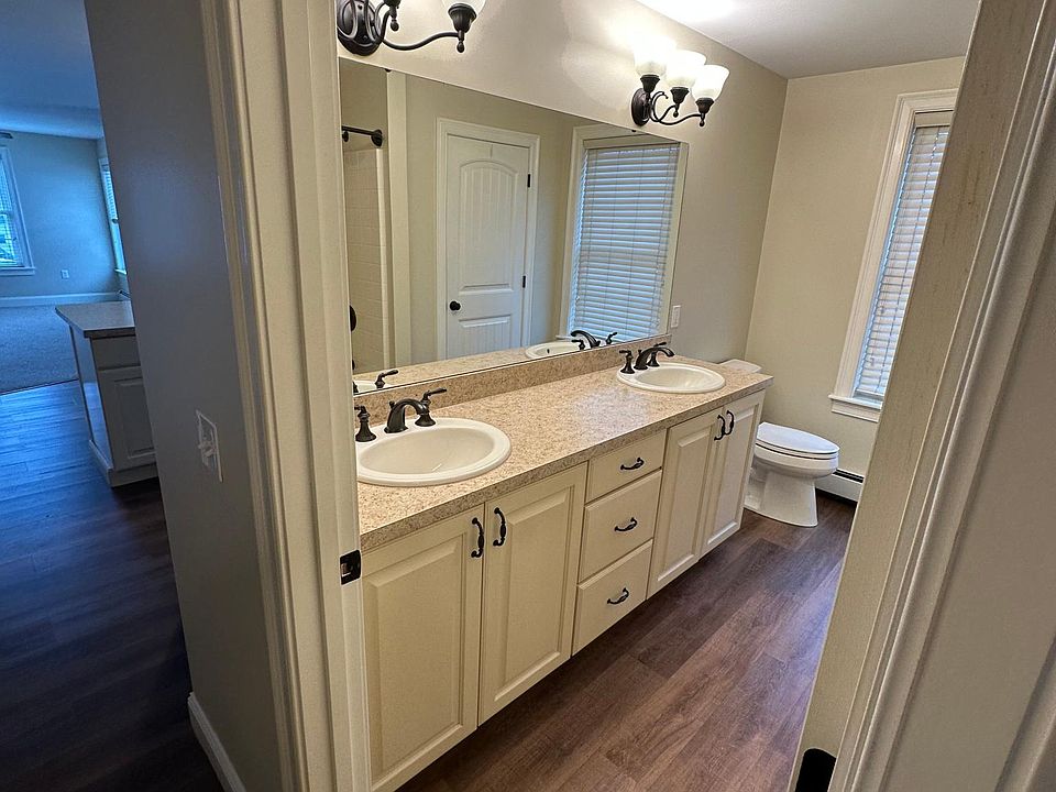 Full bath with two sinks.