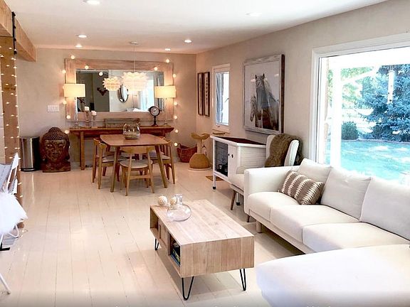 living room open to the dining room and kitchen
