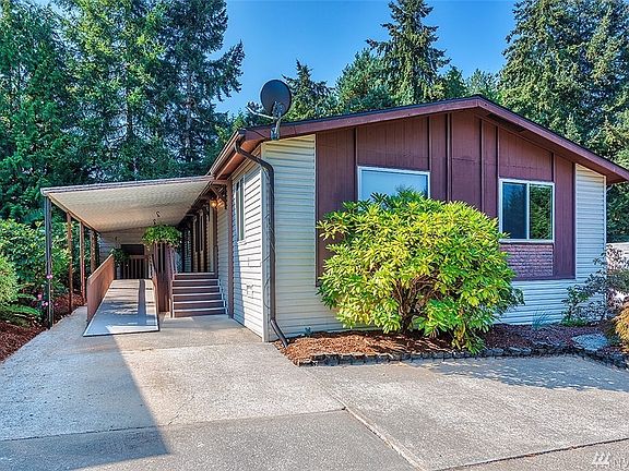 Home features a covered carport and patio