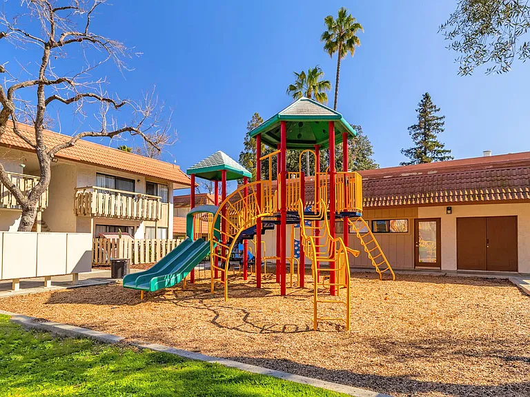 Community playground with colorful play structures.