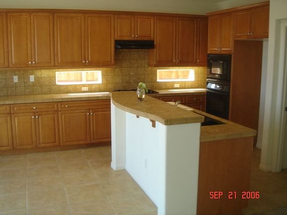 Kitchen black appliances and sink upgraded counters floors and cabinets