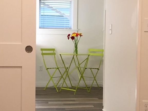 Looking out to kitchen dining area from bedroom.