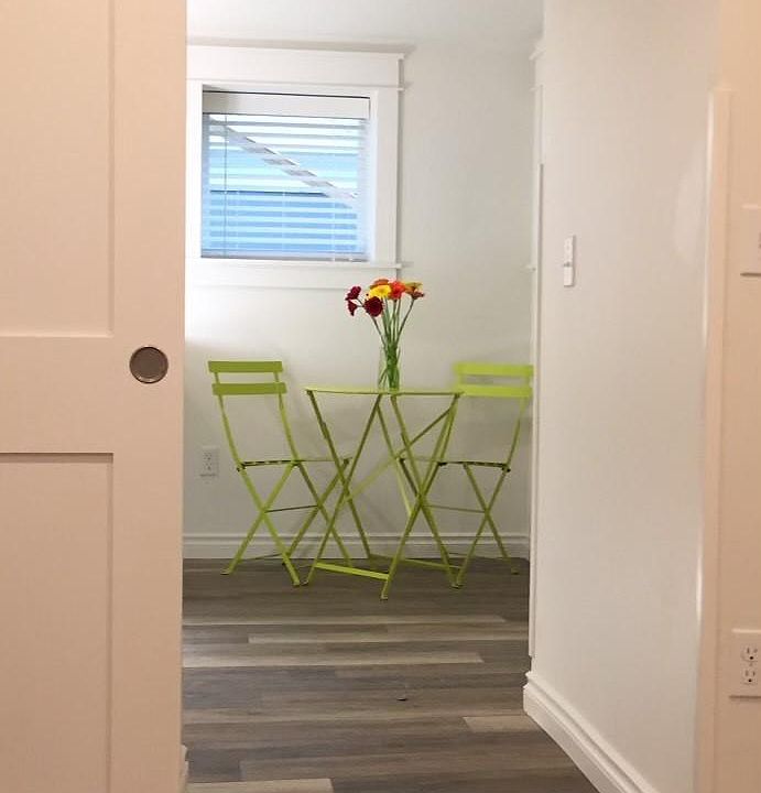 Looking out to kitchen dining area from bedroom.