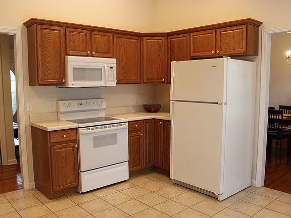 Kitchen comes complete with a refrigerator, microwave, oven/