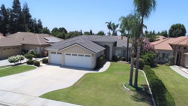 Spacious front yard and three car garage