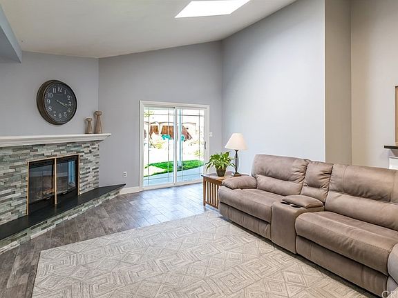 Family room with sloped ceilings, impeccable tile