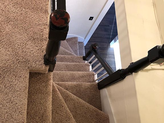 Carpeted stairs to 2nd floor apartment and 3rd floor bedroom