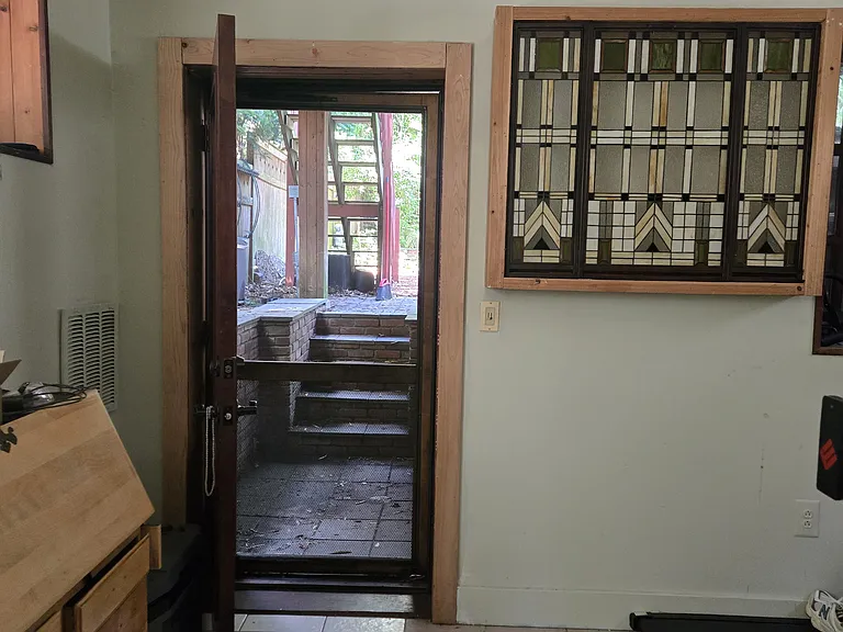 Downstairs walk out to garden/first floor bedroom/family room and can be used as back entrance to entire house.