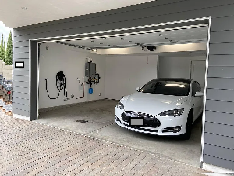 Garage is equipped with Tesla charger.