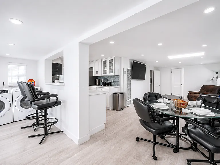 Seamless flow between kitchen, dining, and living areas