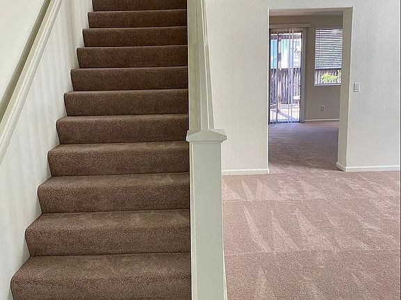 front entryway to stairs and great room on right