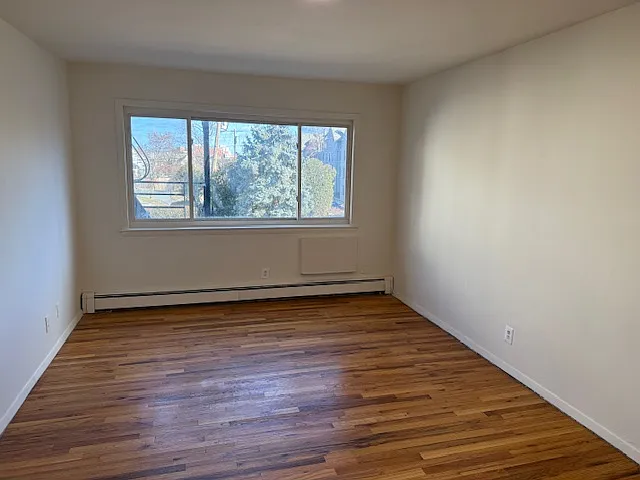 Spacious living room flooded with lots of natural light, unrestricted view.
Hardwood floor.