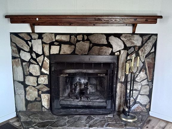 Functioning fireplace to enjoy during the winter.