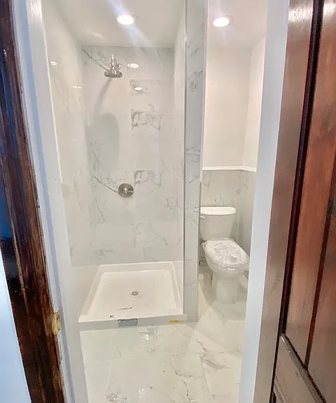 Apt. 6 has the same shower and tile but larger room.