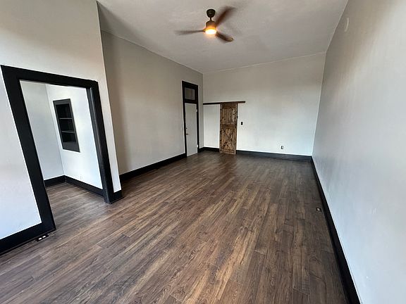 Your very spacious living area. Complete with brand new hardwood flooring.