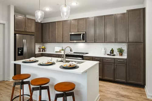 Model Kitchen with Espresso Cabinetry and Stainless Steel Appliances - Bexley Parkstone