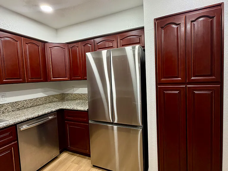 Kitchen with ample cabinet space and brand-new stainless steel appliances