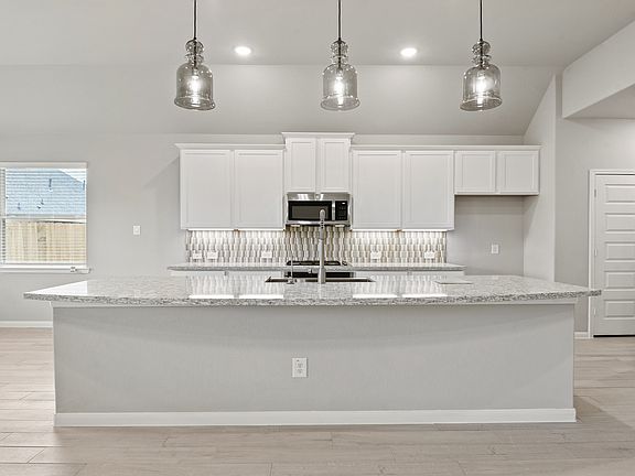 Spacious island and pendant lights