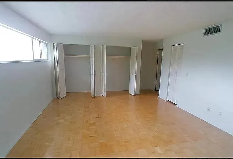 This room will have new flooring installed (same as in picture of smaller room). This is the view pointing towards the Large closet, and the walk in closet is the door on the right