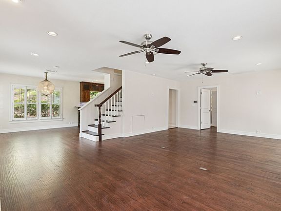 living room and the dining room with the chandelier , photo taken from just inside the front door