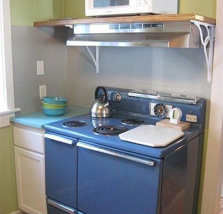 Kitchen with cadet blue large stove