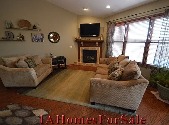 Main level living room has a natural gas fireplace.  The living room, dining room and kitchen is a large open concept area with vaulted ceilings.  Great for entertaining.    