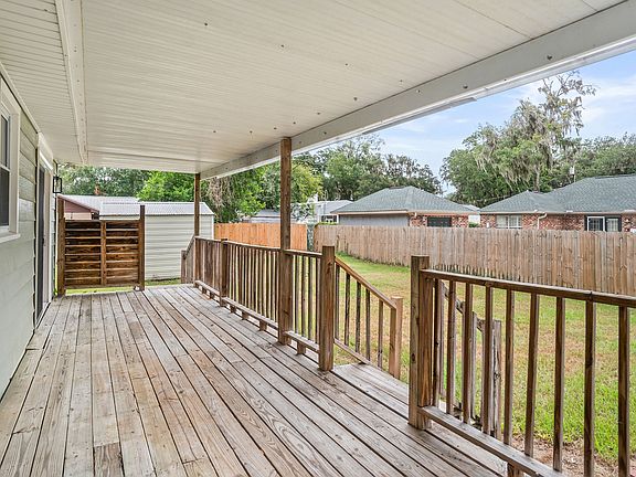 Covered deck w/ access to 2 bedrooms via new sliding glass doors