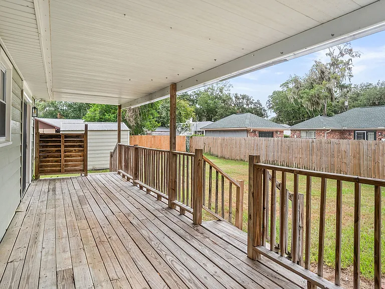 Covered deck w/ access to 2 bedrooms via new sliding glass doors