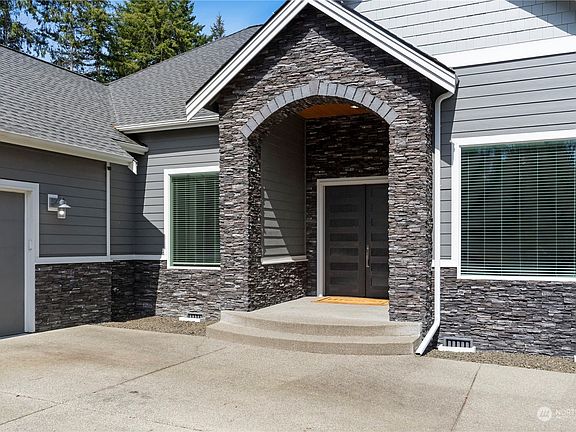 Enter thru the stone entry with 8ft. French Doors and get ready to be "WOWED"!>
