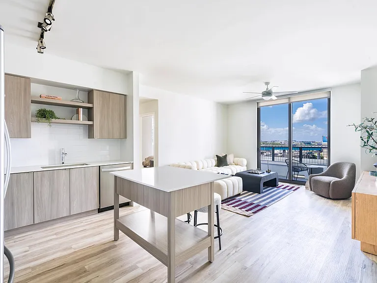 Open-concept living at Modera Riverside pairs sleek finishes with expansive Miami views.