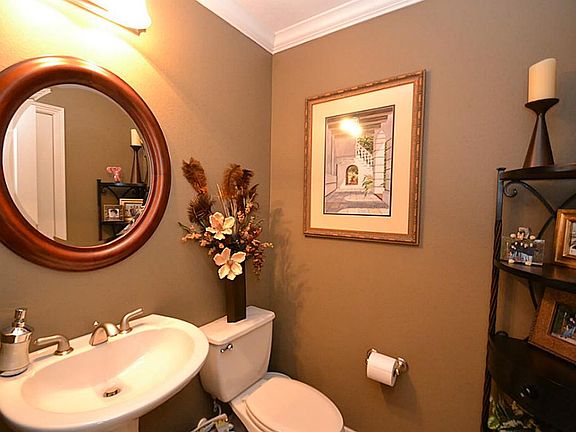 Half bath adjacent to the family room and main hallway.