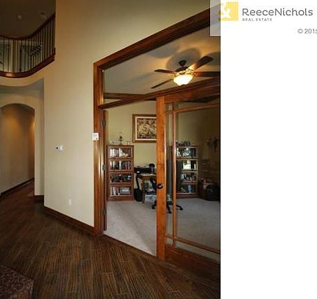 Den on Main Level with Wood French Doors