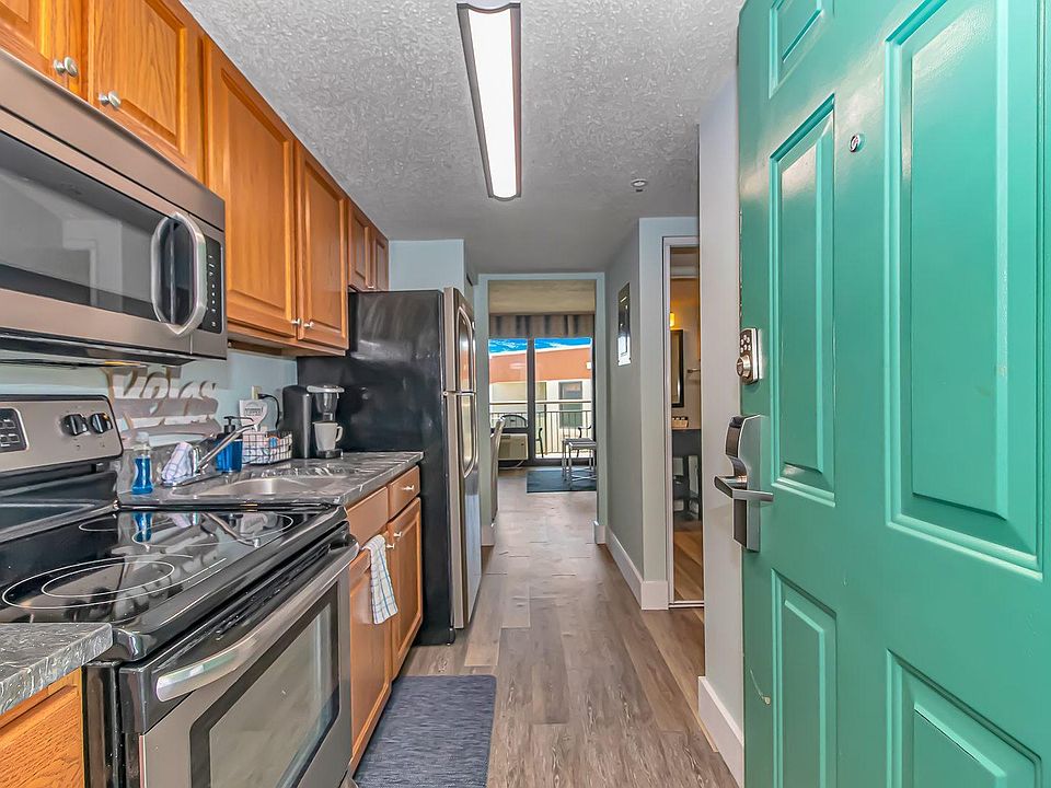 Entryway to updated kitchen with stainless steel appliances and Keurig!