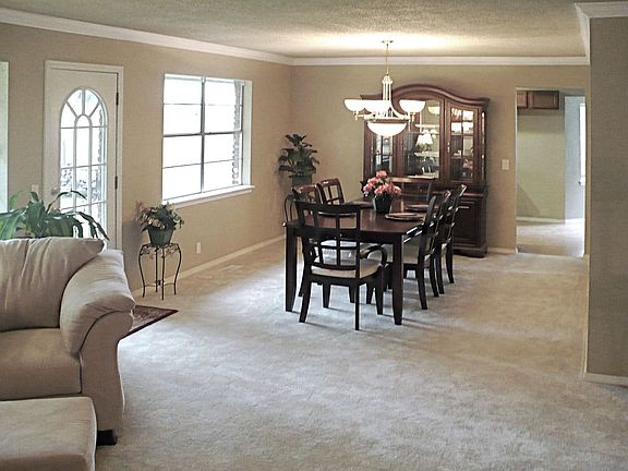 Large formal dining area with new, contemporary chandelier