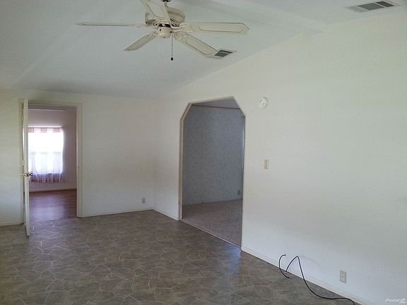 Archway to Living Room & Door to Family Room