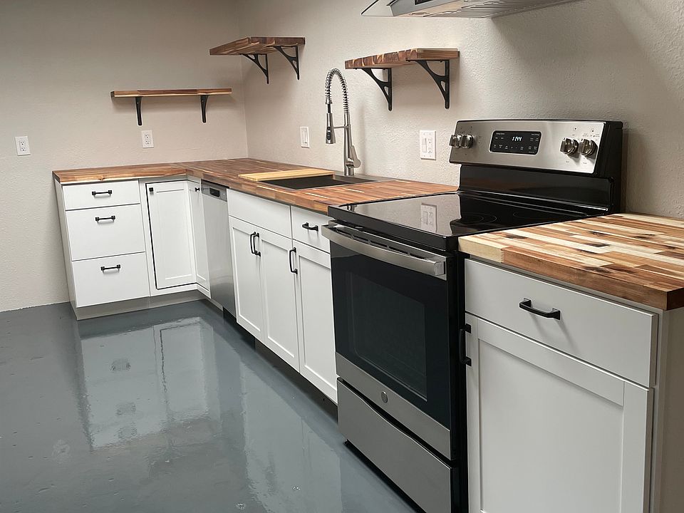 Light, bright kitchen with sky lights and lots of lighting. Stainless refrig/freezer, dishwasher. Oven/cooktop, microwave.