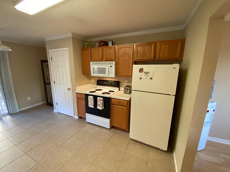 Open style kitchen with convenient access to backyard