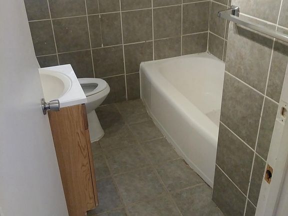 Full bath has newer tile and fresh paint.