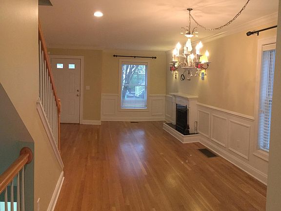 Open space living and dining room with hardwood floors