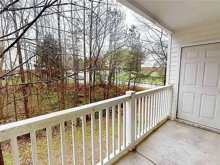 Balcony + Wooded View