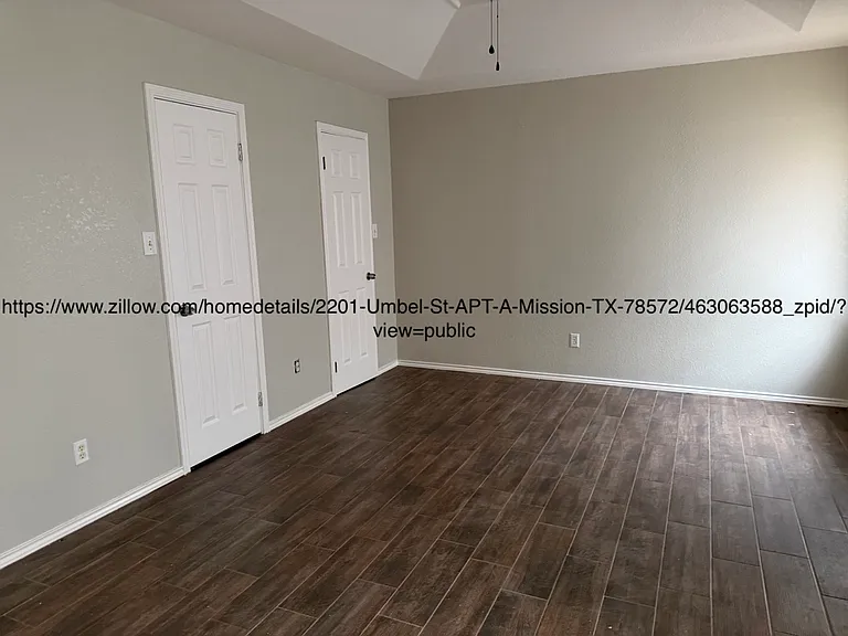 Master bedroom showing doors to walk-in closet