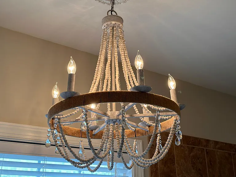 Wood bead and crystal chandelier in the Primary Bath