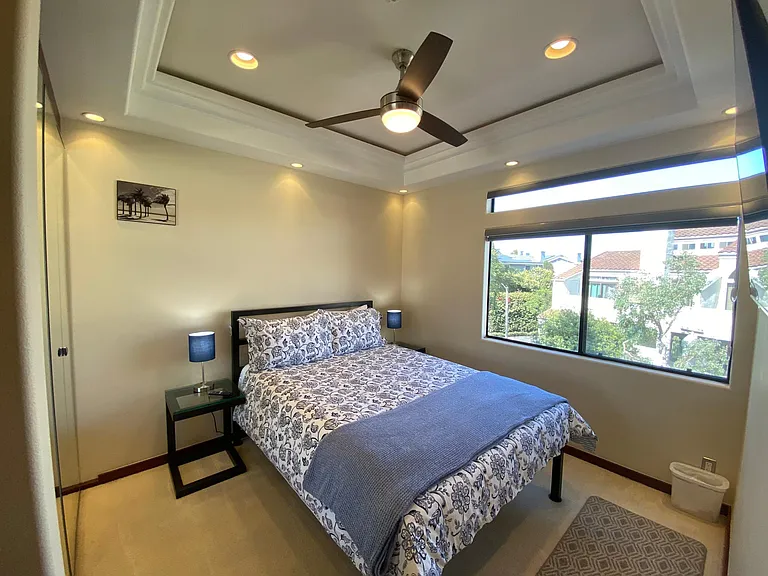 Guest bedroom with large window